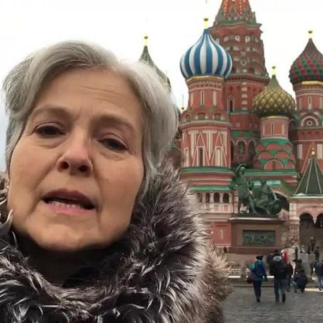 Close up of Jill Stein with famous Moscow building in background