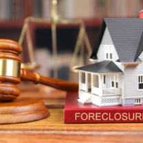 House, gavel and foreclosure sign