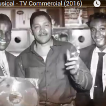 Black and white photo of three guys in recording studio