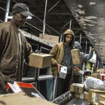 People working with boxes at UPS