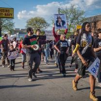 Photo of protestors marching down High Street