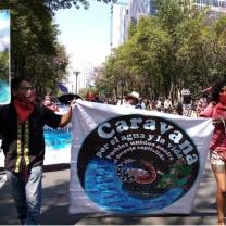 People marching holding sign